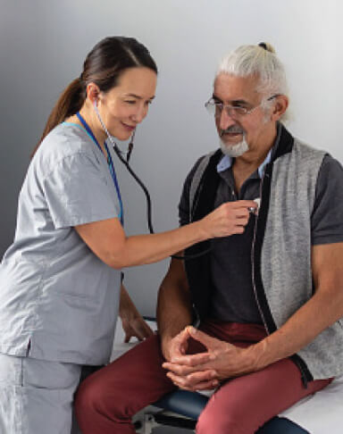 A doctor is performing a health checkup on a senior.