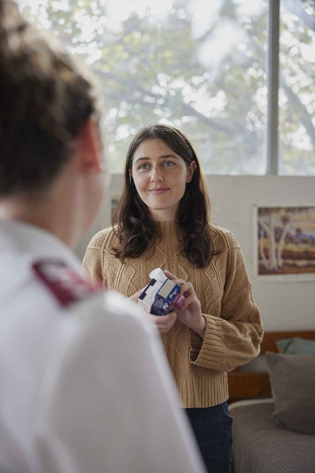 A young woman gets set up into her new, clean, safe accomodation.